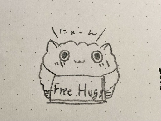 「Free Hugs」の看板をぶら下げたおはぎねこロボ